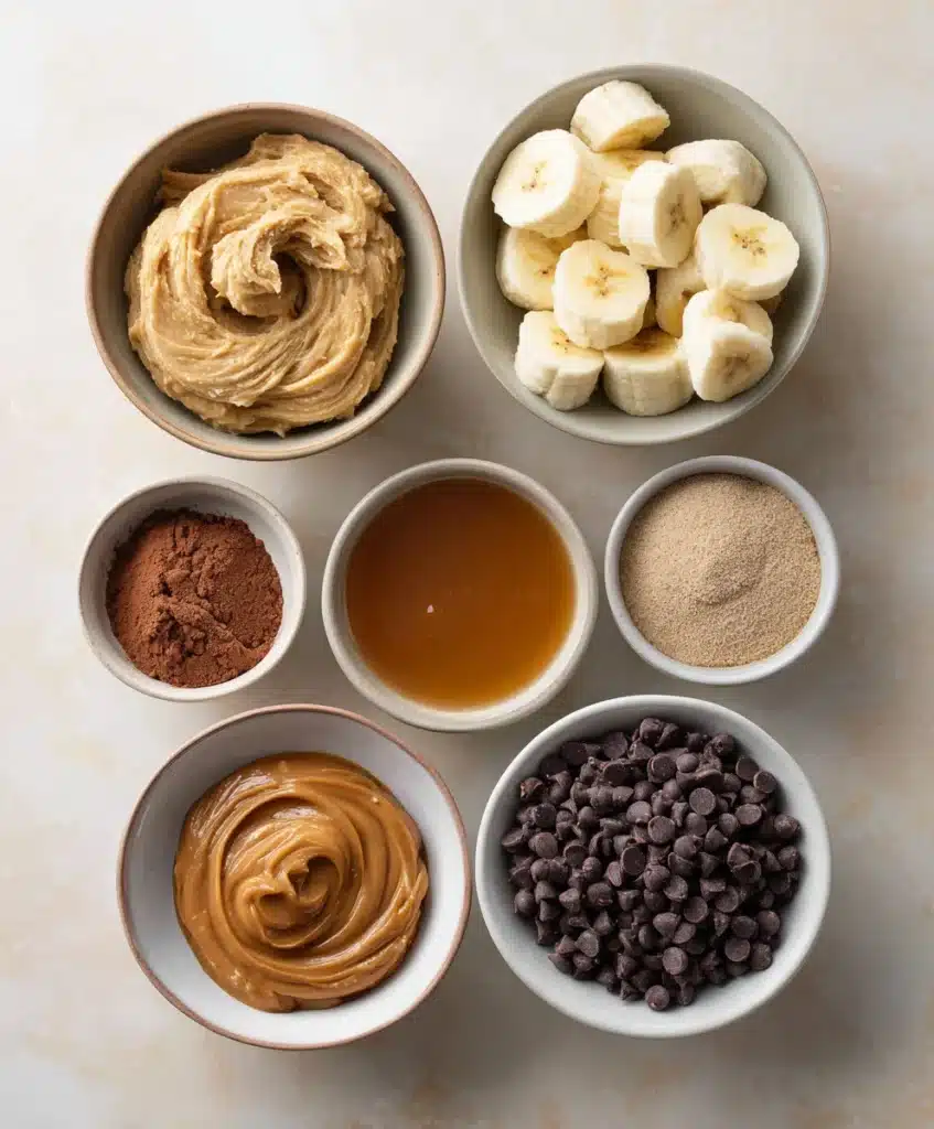 flat lay of ingredients for chocolate peanut butter banana muffins