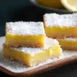 Gluten free lemon bars on a rustic plate